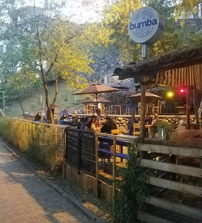 Bumba: Enjoy a beer by the fire and the river