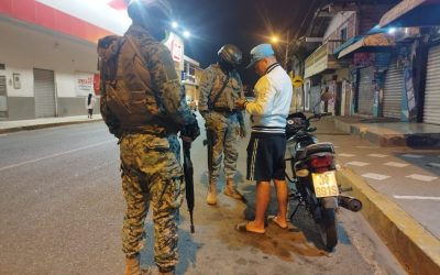 Curfew begins with arrests, checkpoints and military patrols